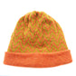 A woollen beanie, with lime green and orange zig-zag pattern, and an orange fold up brim, by K.Moods.