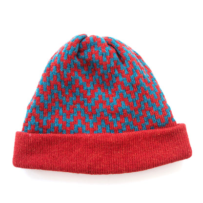A woollen beanie, with red and blue zig-zag pattern, and a red fold up brim, by K.Moods.