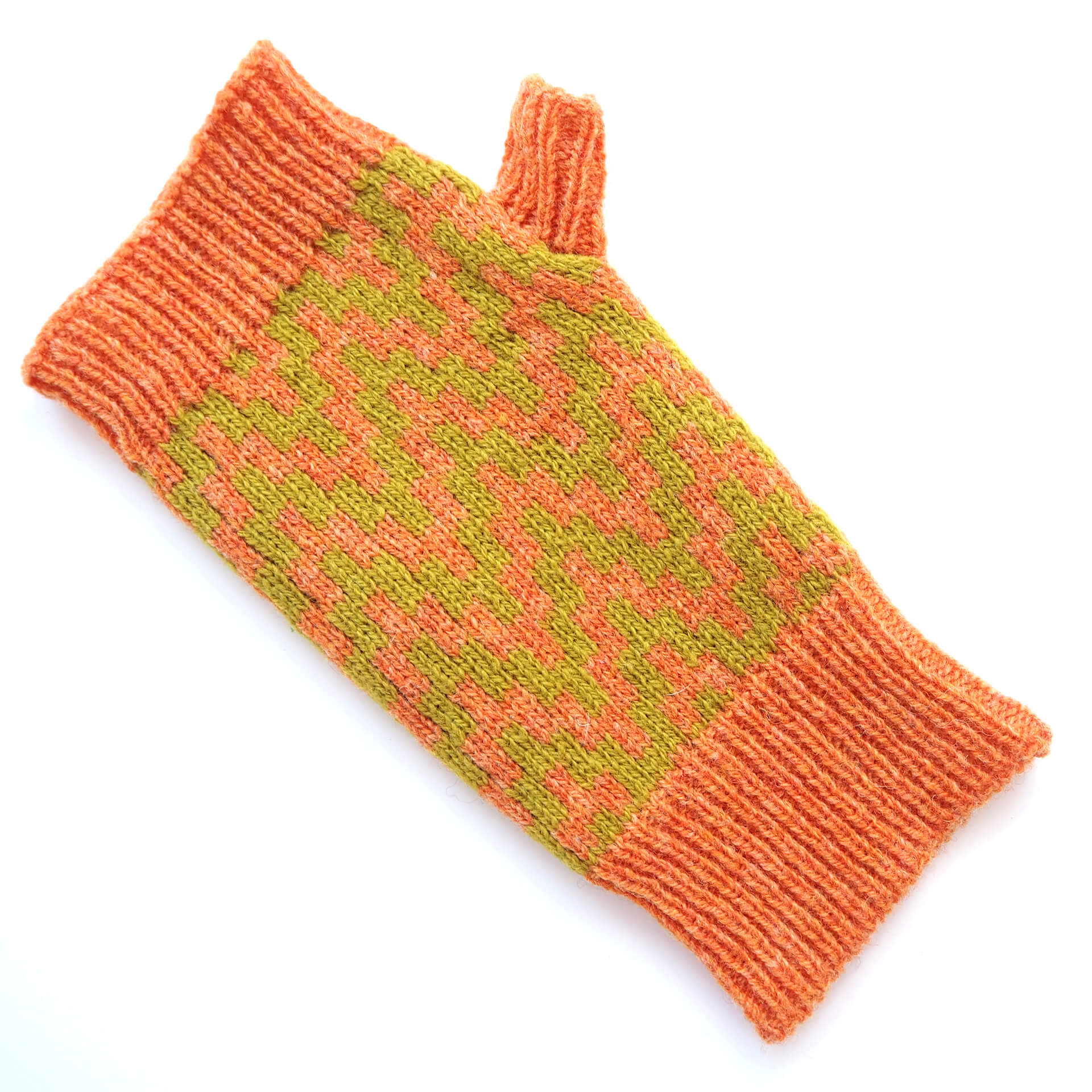 A fingerless glove by K.Moods, it is orange with a thick lime green zig-zag pattern, and sits on a white background. 