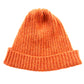 An orange ribbed beanie with a folded brim by K.Moods. It is on a white background.